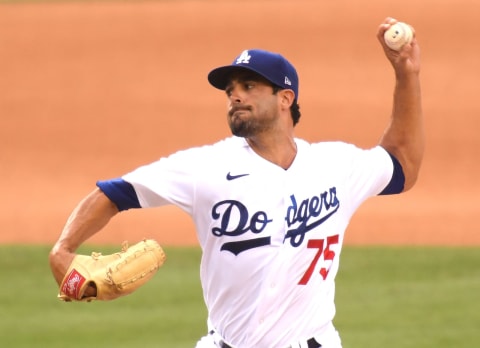 LOS ANGELES, CALIFORNIA – AUGUST 18: Scott Alexander #75 of the Los Angeles Dodgers pitches during the eighth inning against the Seattle Mariners at Dodger Stadium on August 18, 2020 in Los Angeles, California. (Photo by Harry How/Getty Images)