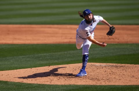 GLENDALE, AZ - MARCH 01: Tony Gonsolin #26 of the Los Angeles Dodgers pitches during a spring training game against the Colorado Rockies at Camelback Ranch on March 1, 2021 in Glendale, Arizona. (Photo by Rob Tringali/Getty Images)