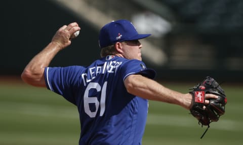 SURPRISE, ARIZONA – MARCH 07: Pitcher Garrett Cleavinger #61 of the Los Angeles Dodgers throws against the Texas Rangers during the sixth inning of the MLB spring training baseball game at Surprise Stadium on March 07, 2021 in Surprise, Arizona. (Photo by Ralph Freso/Getty Images)