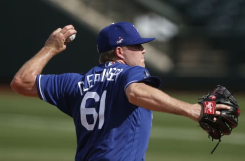 SURPRISE, ARIZONA - MARCH 07: Pitcher Garrett Cleavinger #61 of the Los Angeles Dodgers throws against the Texas Rangers during the sixth inning of the MLB spring training baseball game at Surprise Stadium on March 07, 2021 in Surprise, Arizona. (Photo by Ralph Freso/Getty Images)