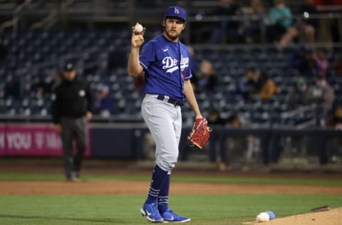 PEORIA, ARIZONA - MARCH 22: Trevor Bauer #27 of the Los Angeles Dodgers reacts in the second inning against the Seattle Mariners during the MLB spring training game at Peoria Sports Complex on March 22, 2021 in Peoria, Arizona. (Photo by Abbie Parr/Getty Images)