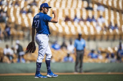 GLENDALE, AZ - MARCH 06: Trevor Bauer #27 of the Los Angeles Dodgers walks back to the mound after a pitch against the San Diego Padres at Camelback Ranch on March 6, 2021 in Glendale, Arizona. (Photo by Matt Thomas/San Diego Padres/Getty Images)