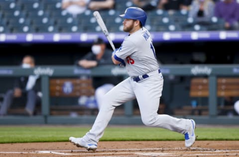 DENVER, CO - APRIL 2: Max Muncy #13 of the Los Angeles Dodgers watches his RBI single during the first inning against the Colorado Rockies at Coors Field on April 2, 2021 in Denver, Colorado. The Rockies defeated the Dodgers 8-5. (Photo by Justin Edmonds/Getty Images)