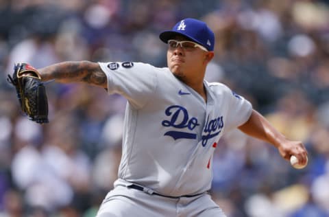 DENVER, CO - APRIL 4: Starting pitcher Julio Urias #7 of the Los Angeles Dodgers delivers to home plate during the first inning against the Colorado Rockies at Coors Field on April 4, 2021 in Denver, Colorado. (Photo by Justin Edmonds/Getty Images)