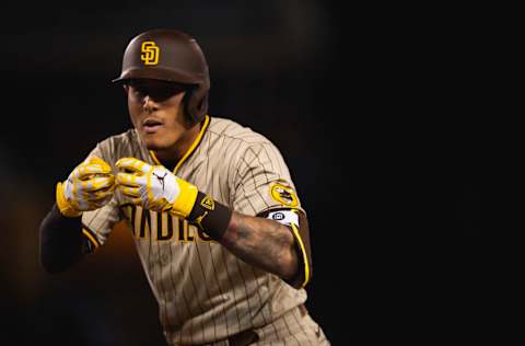 LOS ANGELES, CA - APRIL 22: Manny Machado #13 of the San Diego Padres celebrates an RBI single in the fourth inning against the Los Angeles Dodgers on April 22, 2021 at Dodger Stadium in Los Angeles, California. (Photo by Matt Thomas/San Diego Padres/Getty Images)