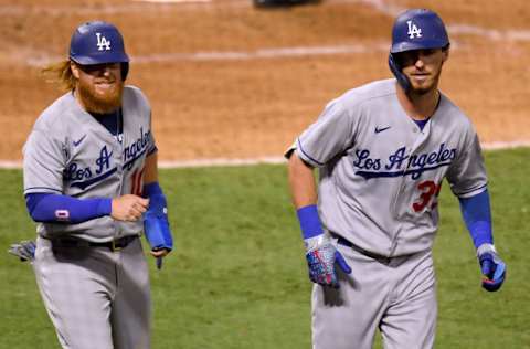 ANAHEIM, CALIFORNIA - AUGUST 14: Cody Bellinger #35 of the Los Angeles Dodgers reacts to his two run homerun with Justin Turner #10, to take a 4-1 lead over the Los Angeles Angels, during the sixth inning at Angel Stadium of Anaheim on August 14, 2020 in Anaheim, California. (Photo by Harry How/Getty Images)