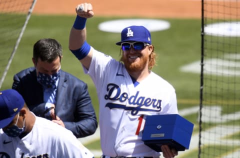 LOS ANGELES, CALIFORNIA - APRIL 09: Justin Turner #2 of the Los Angeles Dodgers acknowledges the crowd after receiving his World Series ring prior to the game against the Washington Nationals at Dodger Stadium on April 09, 2021 in Los Angeles, California. (Photo by Harry How/Getty Images)