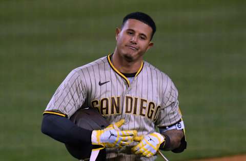 LOS ANGELES, CALIFORNIA - APRIL 22: Manny Machado #13 of the San Diego Padres reacts to his out to end the eighth inning against the Los Angeles Dodgers during the eighth inning at Dodger Stadium on April 22, 2021 in Los Angeles, California. (Photo by Harry How/Getty Images)