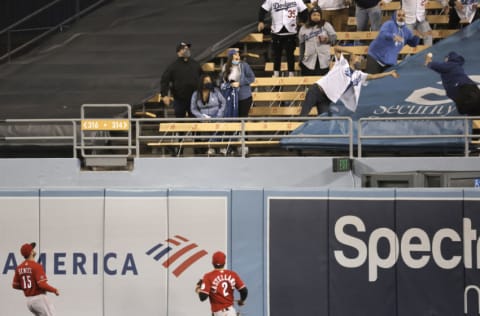 LOS ANGELES, CALIFORNIA - APRIL 26: Nick Senzel #15 of the Cincinnati Reds and Nick Castellanos #2 of the Cincinnati Reds watch as Corey Seager #5 of the Los Angeles Dodgers two run home run flies over the wall to tie up the game during the seventh inning, 3-3, at Dodger Stadium on April 26, 2021 in Los Angeles, California. Austin Barnes #15 of the Los Angeles Dodgers scored. (Photo by Michael Owens/Getty Images)