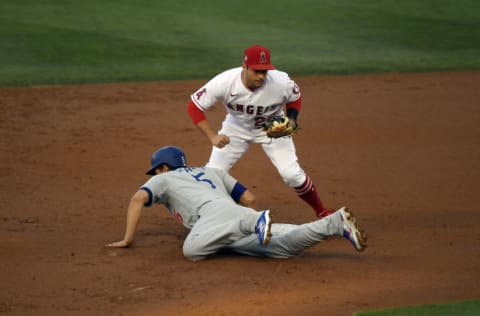 ANAHEIM, CA - MAY 07: David Fletcher #22 of the Los Angeles Angels picks off Corey Seager #5 of the Los Angeles Dodgers at second base during the first inning at Angel Stadium of Anaheim on May 7, 2021 in Anaheim, California. (Photo by Kevork Djansezian/Getty Images)