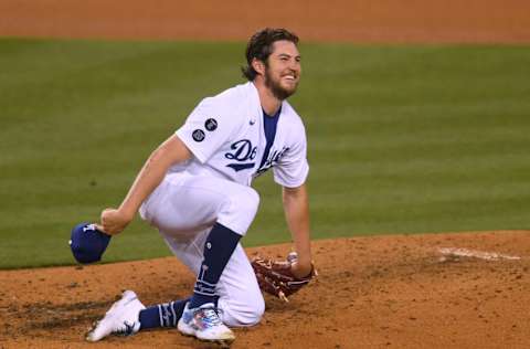 LOS ANGELES, CALIFORNIA - APRIL 24: Trevor Bauer #27 of the Los Angeles Dodgers reacts after a line drive single from Eric Hosmer #30 of the San Diego Padres during the sixth inning at Dodger Stadium on April 24, 2021 in Los Angeles, California. (Photo by Harry How/Getty Images)