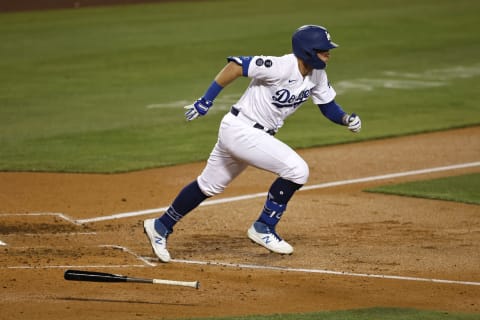 LOS ANGELES, CALIFORNIA – MAY 12: Matt Beaty #45 of the Los Angeles Dodgers hits a two RBI double to right field against the Seattle Mariners during the fourth inning at Dodger Stadium on May 12, 2021 in Los Angeles, California. Justin Turner #10 and Max Muncy #13 scored on the play. (Photo by Michael Owens/Getty Images)