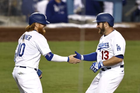 LOS ANGELES, CALIFORNIA – MAY 12: Max Muncy #13 of the Los Angeles Dodgers celebrates with Justin Turner #10 of the Los Angeles Dodgers after hitting a two run home run against the Seattle Mariners during the fifth inning at Dodger Stadium on May 12, 2021 in Los Angeles, California. (Photo by Michael Owens/Getty Images)