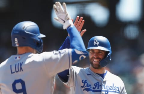 SAN FRANCISCO, CALIFORNIA - MAY 23: Gavin Lux #9 of the Los Angeles Dodgers celebrates with teammate Chris Taylor #3 after hitting a grand slam in the top of the third inning against the San Francisco Giants at Oracle Park on May 23, 2021 in San Francisco, California. (Photo by Lachlan Cunningham/Getty Images)