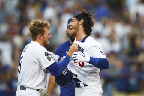 Cody Bellinger #35 of the Los Angeles Dodgers celebrates his walk-off home run with Gavin Lux #9 (Photo by Meg Oliphant/Getty Images)