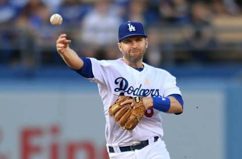 LOS ANGELES, CA - SEPTEMBER 01: Brian Dozier #6 of the Los Angeles Dodgers makes a throw to first base in the first inning against the Arizona Diamondbacks at Dodger Stadium on September 1, 2018 in Los Angeles, California. (Photo by John McCoy/Getty Images)