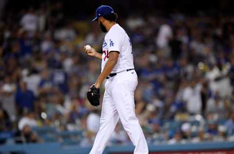 LOS ANGELES, CA - JULY 21: Closer Kenley Jansen #74 of the Los Angeles Dodgers looks at the baseball after giving up a two-run home run to Wilmer Flores of the San Francisco Giants in the ninth inning at Dodger Stadium on July 21, 2021 in Los Angeles, California. (Photo by Kevork Djansezian/Getty Images)