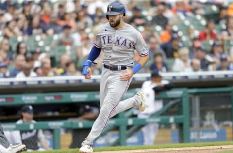 DETROIT, MI - JULY 22: Joey Gallo #13 of the Texas Rangers scores against the Detroit Tigers on single by David Dahl during the sixth inning at Comerica Park on July 22, 2021, in Detroit, Michigan. (Photo by Duane Burleson/Getty Images)