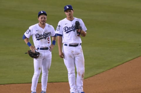 LOS ANGELES, CALIFORNIA - APRIL 10: Gavin Lux #9 and Corey Seager #5 of the Los Angeles Dodgers wait at second after a 9-6 win over the Washington Nationals at Dodger Stadium on April 10, 2021 in Los Angeles, California. (Photo by Harry How/Getty Images)