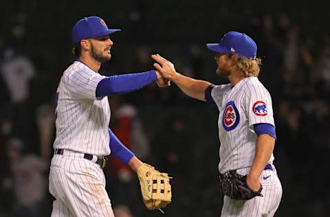 CHICAGO, ILLINOIS - APRIL 20: Kris Bryant #17 (L) and Craig Kimbrel #46 of the Chicago Cubs celebrate a win over the New York Mets at Wrigley Field on April 20, 2021 in Chicago, Illinois. The Cubs defeated the Mets 3-1. (Photo by Jonathan Daniel/Getty Images)