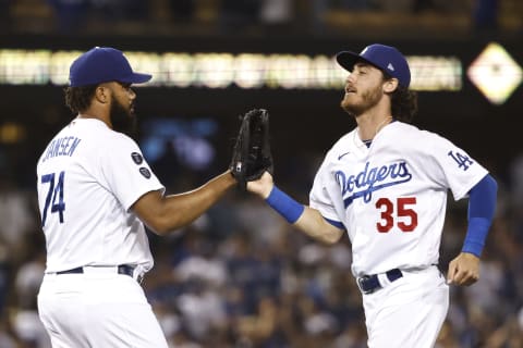 Kenley Jansen of the Los Angeles Dodgers celebrates with Cody Bellinger (Photo by Michael Owens/Getty Images)