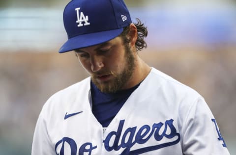 LOS ANGELES, CALIFORNIA - JUNE 28: Trevor Bauer #27 of the Los Angeles Dodgers returns to the dugout after the top of the first inning against the San Francisco Giants at Dodger Stadium on June 28, 2021 in Los Angeles, California. (Photo by Meg Oliphant/Getty Images)