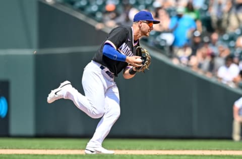 DENVER, CO - JULY 11: Michael Busch #15 of National League Futures Team fields a ground ball against the American League Futures Team at Coors Field on July 11, 2021 in Denver, Colorado.(Photo by Dustin Bradford/Getty Images)