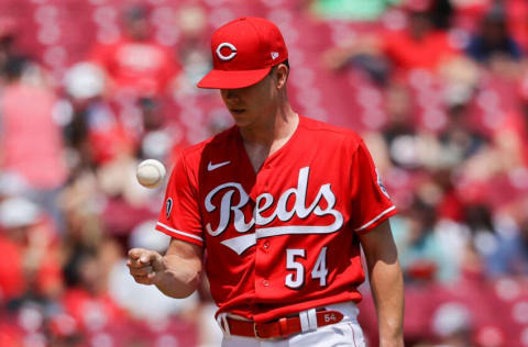 CINCINNATI, OHIO - JULY 18: Sonny Gray #54 of the Cincinnati Reds tosses the ball in the fifth inning against the Milwaukee Brewers at Great American Ball Park on July 18, 2021 in Cincinnati, Ohio. (Photo by Dylan Buell/Getty Images)