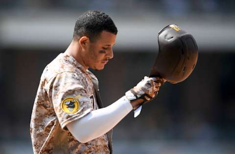 SAN DIEGO, CA - AUGUST 22: Manny Machado #13 of the San Diego Padres takes off his helmet after lining out during the fifth inning of a baseball game agains the Philadelphia Phillies at Petco Park on August 22, 2021 in San Diego, California. (Photo by Denis Poroy/Getty Images)