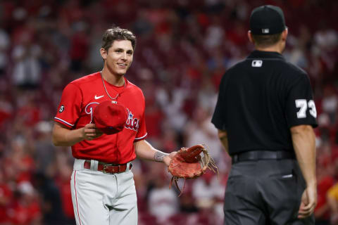 CINCINNATI, OHIO – JUNE 28: Nick Maton #29 of the Philadelphia Phillies has his hat and glove inspected for foreign substances by umpire Tripp Gibson in the eighth inning against the Cincinnati Reds at Great American Ball Park on June 28, 2021 in Cincinnati, Ohio. (Photo by Dylan Buell/Getty Images)