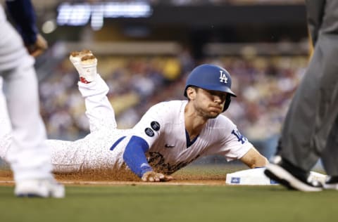 LOS ANGELES, CALIFORNIA - AUGUST 17: Trea Turner #6 of the Los Angeles Dodgers slides into third base against the Pittsburgh Pirates during the first inning at Dodger Stadium on August 17, 2021 in Los Angeles, California. (Photo by Michael Owens/Getty Images)