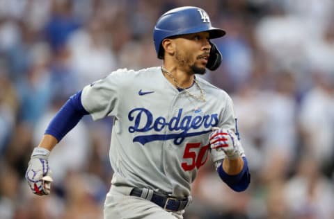 DENVER, COLORADO - JULY 17: Mookie Betts #50 of the Los Angeles Dodgers runs after hitting a double against the Colorado Rockies in the seventh inning at Coors Field on July 17, 2021 in Denver, Colorado. (Photo by Matthew Stockman/Getty Images)