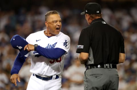 LOS ANGELES, CALIFORNIA - JULY 22: Manager Dave Roberts #30 of the Los Angeles Dodgers reacts after first base umpire Ed Hickox #15 made the call on a no-swing for a walk to Darin Ruf of the San Francisco Giants to tie the game 3-3 in the ninth inning at Dodger Stadium on July 22, 2021 in Los Angeles, California. (Photo by Katelyn Mulcahy/Getty Images)