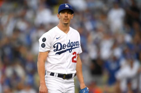 LOS ANGELES, CA - AUGUST 03: Walker Buehler #21 of the Los Angeles Dodgers walks back to the dugout after the first inning against the Houston Astros at Dodger Stadium on August 3, 2021 in Los Angeles, California. (Photo by Jayne Kamin-Oncea/Getty Images)