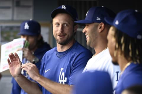 LOS ANGELES, CA - AUGUST 03: Max Scherzer #31 and Albert Pujols #55 of the Los Angeles Dodgers talk in the dugout before the game against the Houston Astros at Dodger Stadium on August 3, 2021 in Los Angeles, California. (Photo by Jayne Kamin-Oncea/Getty Images)