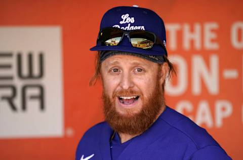 SAN FRANCISCO, CALIFORNIA - SEPTEMBER 05: Justin Turner #10 of the Los Angeles Dodgers wearing their city connect hat looks on from the dugout prior to the start of the game against the San Francisco Giants at Oracle Park on September 05, 2021 in San Francisco, California. (Photo by Thearon W. Henderson/Getty Images)