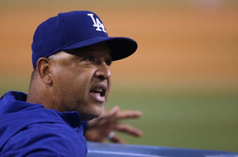 LOS ANGELES, CALIFORNIA - SEPTEMBER 15: Manager Dave Roberts #30 of the Los Angeles Dodgers during the game against the Arizona Diamondbacks at Dodger Stadium on September 15, 2021 in Los Angeles, California. (Photo by Harry How/Getty Images)