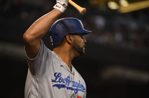 PHOENIX, ARIZONA - SEPTEMBER 25: Albert Pujols #55 of the Los Angeles Dodgers gets ready to step into the batters box against the Arizona Diamondbacks at Chase Field on September 25, 2021 in Phoenix, Arizona. (Photo by Norm Hall/Getty Images)