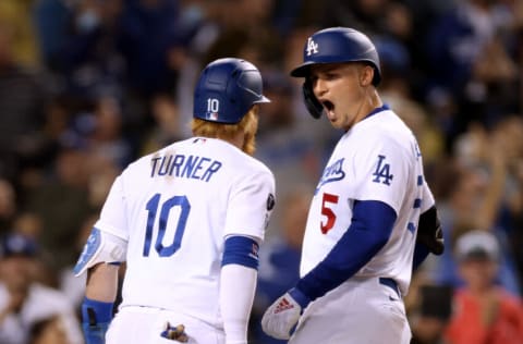 LOS ANGELES, CALIFORNIA - SEPTEMBER 29: Corey Seager #5 of the Los Angeles Dodgers celebrates his two run homerun with Justin Turner #10, to take a 11-9 lead over the San Diego Padres, during the eighth inning at Dodger Stadium on September 29, 2021 in Los Angeles, California. (Photo by Harry How/Getty Images)