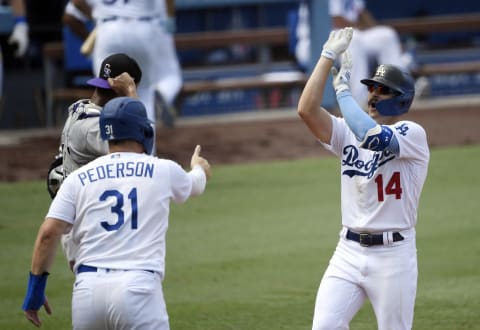 Enrique Hernandez #14 of the Los Angeles Dodgers celebrates his three run hone run with Joc Pederson #31 (Photo by Kevork Djansezian/Getty Images)