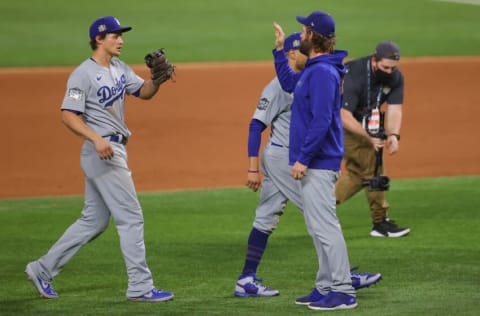 ARLINGTON, TEXAS - OCTOBER 23: Corey Seager #5 and Clayton Kershaw #22 of the Los Angeles Dodgers celebrate the teams 6-2 victory against the Tampa Bay Rays in Game Three of the 2020 MLB World Series at Globe Life Field on October 23, 2020 in Arlington, Texas. (Photo by Ronald Martinez/Getty Images)