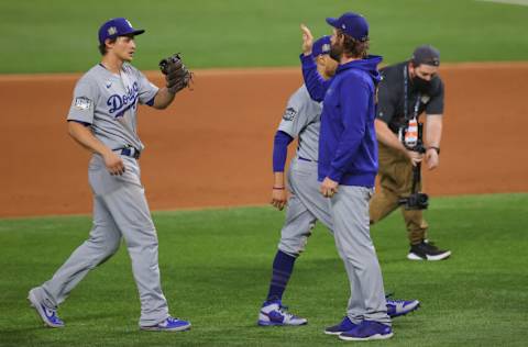 ARLINGTON, TEXAS - OCTOBER 23: Corey Seager #5 and Clayton Kershaw #22 of the Los Angeles Dodgers celebrate the teams 6-2 victory against the Tampa Bay Rays in Game Three of the 2020 MLB World Series at Globe Life Field on October 23, 2020 in Arlington, Texas. (Photo by Ronald Martinez/Getty Images)