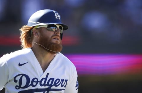 LOS ANGELES, CALIFORNIA - SEPTEMBER 12: Justin Turner #10 of the Los Angeles Dodgers hits a three run home run against the San Diego Padres in the seventh inning at Dodger Stadium on September 12, 2021 in Los Angeles, California. (Photo by Meg Oliphant/Getty Images)