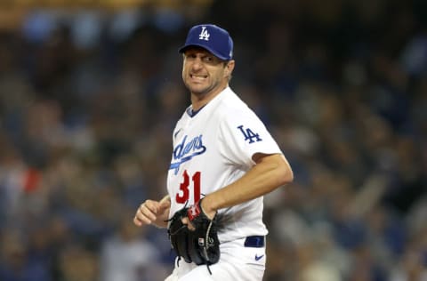 LOS ANGELES, CALIFORNIA - OCTOBER 11: Max Scherzer #31 of the Los Angeles Dodgers reacts after striking out LaMonte Wade Jr. #31 of the San Francisco Giants during the fourth inning in game 3 of the National League Division Series at Dodger Stadium on October 11, 2021 in Los Angeles, California. (Photo by Ronald Martinez/Getty Images)