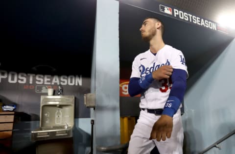 LOS ANGELES, CALIFORNIA - OCTOBER 11: Cody Bellinger #35 of the Los Angeles Dodgers stands in the dugout against the San Francisco Giants during the seventh inning in game 3 of the National League Division Series at Dodger Stadium on October 11, 2021 in Los Angeles, California. (Photo by Ronald Martinez/Getty Images)