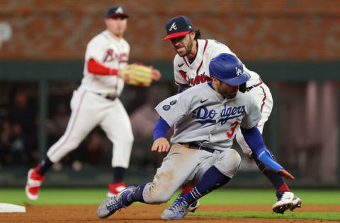 ATLANTA, GEORGIA - OCTOBER 16: Chris Taylor #3 of the Los Angeles Dodgers is tagged out in a rundown by Dansby Swanson #7 of the Atlanta Braves during the ninth inning of Game One of the National League Championship Series at Truist Park on October 16, 2021 in Atlanta, Georgia. (Photo by Kevin C. Cox/Getty Images)