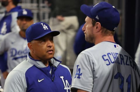 ATLANTA, GEORGIA - OCTOBER 17: Manager Dave Roberts talks to Max Scherzer #31 of the Los Angeles Dodgers after he took him out of the game against the Atlanta Braves in the fifth inning of Game Two of the National League Championship Series at Truist Park on October 17, 2021 in Atlanta, Georgia. (Photo by Kevin C. Cox/Getty Images)