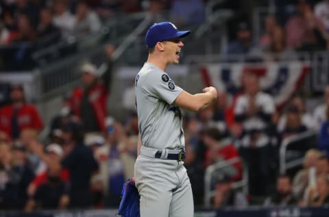 ATLANTA, GEORGIA - OCTOBER 23: Walker Buehler #21 of the Los Angeles Dodgers reacts to a play during the fourth inning of Game Six of the National League Championship Series against the Atlanta Braves at Truist Park on October 23, 2021 in Atlanta, Georgia. (Photo by Kevin C. Cox/Getty Images)