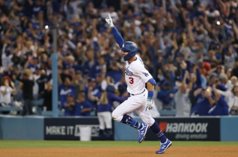 LOS ANGELES, CALIFORNIA - OCTOBER 06: Chris Taylor #3 of the Los Angeles Dodgers celebrates his walk off two-run home run in the ninth inning to defeat the St. Louis Cardinals 3 to 1 during the National League Wild Card Game at Dodger Stadium on October 06, 2021 in Los Angeles, California. (Photo by Sean M. Haffey/Getty Images)