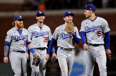 SAN FRANCISCO, CALIFORNIA - OCTOBER 09: (L-R) Justin Turner #10, Cody Bellinger #35, Trea Turner #6, and Corey Seager #5 of the Los Angeles Dodgers celebrate after beating the San Francisco Giants in Game 2 of the National League Division Series at Oracle Park on October 09, 2021 in San Francisco, California. (Photo by Harry How/Getty Images)